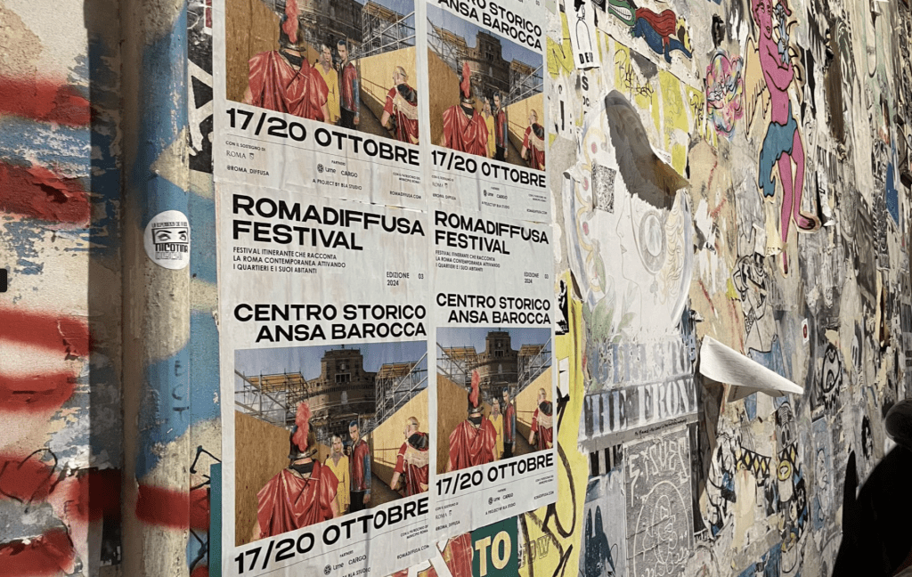 Posters cover a wall in Pigneto, Italy.