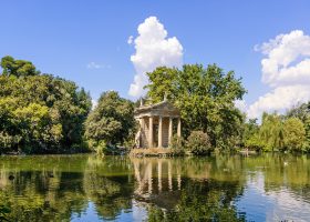 A temple overlooking a lake.