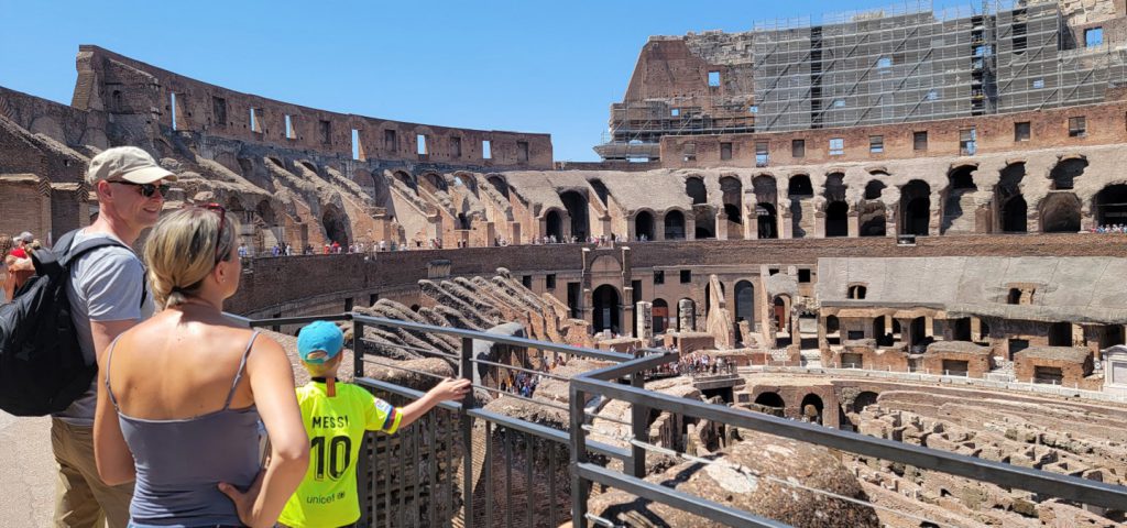 family looking at arena floor and underground of colosseum