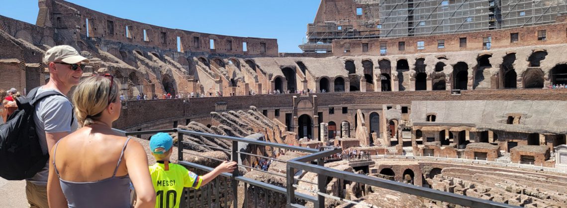 family looking at arena floor and underground of colosseum