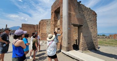 tour guide and people in pompeii