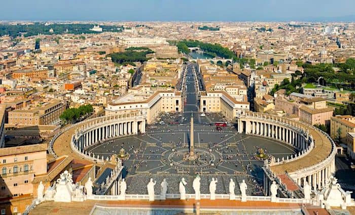 View of St Peter's square from St. Peter's Basilica with Rome in the background