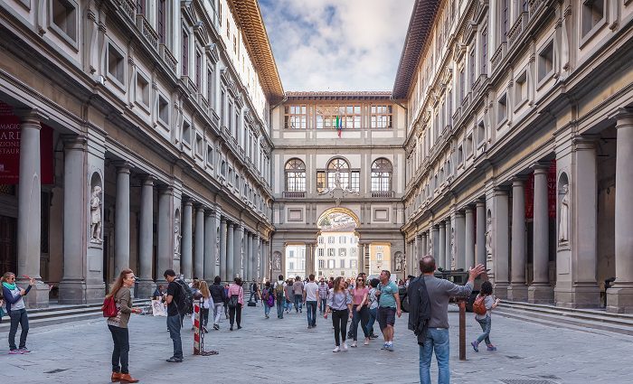 Exterior of the Uffizi Gallery in Florence with visitors in the foreground