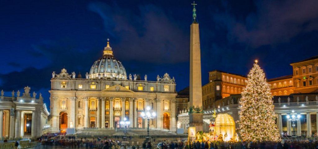st peter's square at night with christmas tree and nativity scene