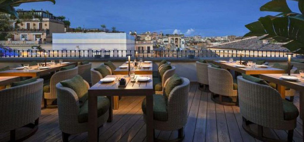outside tables of an empty restaurant in Rome