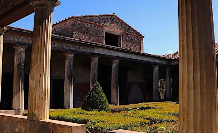 Structure with columns and a central garden of the Pompeii Forum bath house.